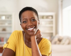 Woman in yellow shirt smiling