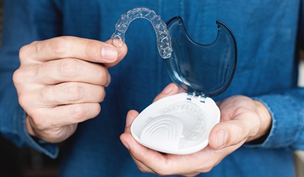 Patient holding clear aligner and clear aligner case