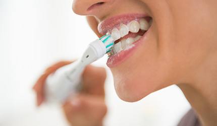 Brush gently with a soft-bristled toothbrush after scaling and root planing